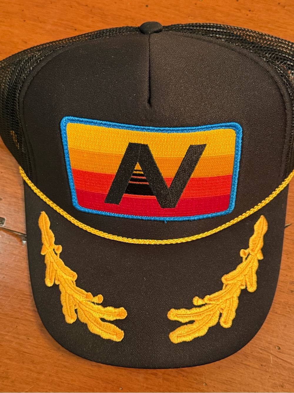 Aviator Nation Black Trucker Hat with Yellow Embroidery and Multicolor Patch